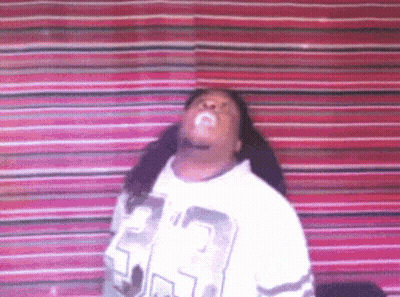 A Woman Wearing A White Sweater With The Number 53 On It GIF