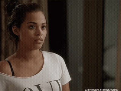 A Woman Wearing A White T-Shirt That Says " All Things Lauren London " GIF