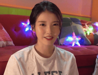 A Woman Wearing A White T-Shirt That Says Ufc Smiles GIF