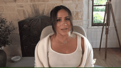 A Woman Wearing A White Tank Top And A Necklace That Says ' I Love You ' On It GIF