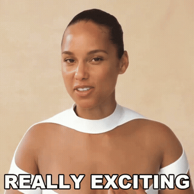 A Woman Wearing A White Top Says Really Exciting GIF