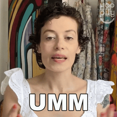 A Woman Wearing A White Top Says Umm GIF