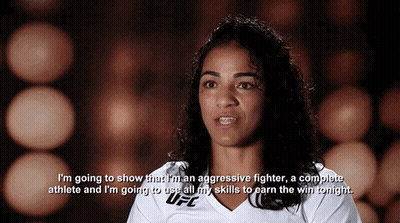 A Woman Wearing A White Ufc Shirt Says I 'M Going To Show That I Am An Aggressive Fighter GIF