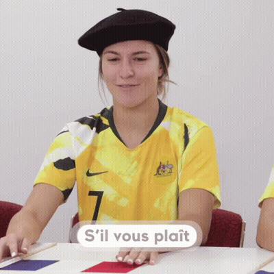 A Woman Wearing A Yellow Jersey With The Number 7 GIF