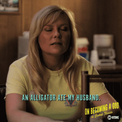 A Woman Wearing A Yellow Shirt That Says " An Alligator Ate My Husband " GIF