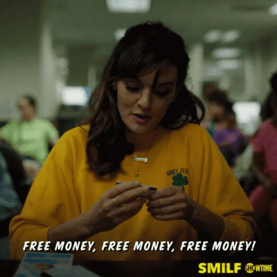 A Woman Wearing A Yellow Shirt That Says Barley Tea Is Sitting At A Table GIF