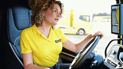 A Woman Wearing A Yellow Shirt That Says Daf On It GIF
