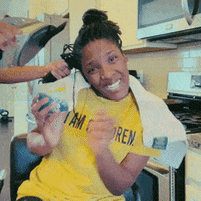 A Woman Wearing A Yellow Shirt That Says " I Am Sore " GIF