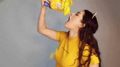 A Woman Wearing A Yellow Shirt That Says New Hood On It GIF