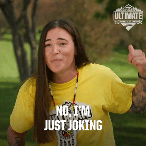 A Woman Wearing A Yellow Shirt That Says No I 'M Just Joking Gives A Thumbs Up GIF