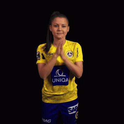 A Woman Wearing A Yellow Shirt That Says Uniqa On The Front GIF