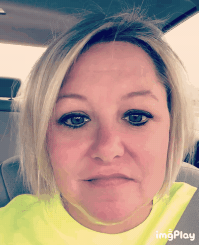 A Woman Wearing A Yellow Shirt With Imgplay Written On The Bottom Right GIF