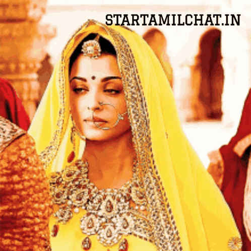 A Woman Wearing A Yellow Veil With The Words Starttamilchat.in Above Her GIF