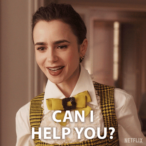 A Woman Wearing A Yellow Vest And A Bow Tie Says Can I Help You GIF