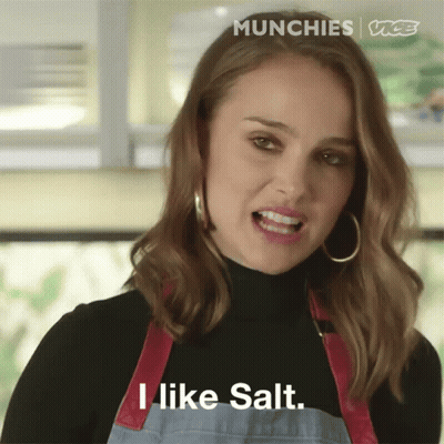 A Woman Wearing An Apron And A Black Turtleneck Says " I Like Salt " GIF