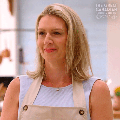 Woman In Apron Blue Shirt Smiling Baking GIF