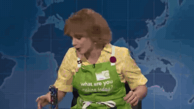 A Woman Wearing An Apron That Says What Are You Making Today GIF