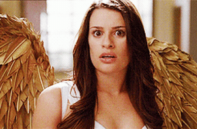 A Woman Wearing Angel Wings Looks Surprised And Shocked GIF