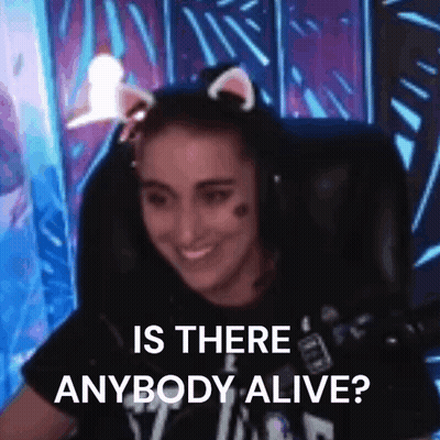 A Woman Wearing Cat Ears Is Sitting In A Chair With A Microphone And Smiling . GIF