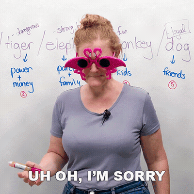 A Woman Wearing Flamingo Sunglasses Is Standing In Front Of A Whiteboard With Words Like Tiger Elephant And Monkey Writt GIF