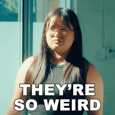 A Woman Wearing Glasses And A Black Tank Top Says They 'Re So Weird GIF