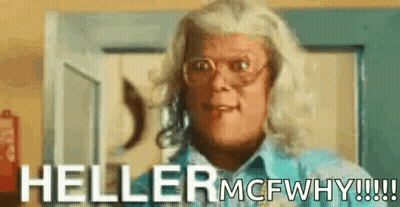 A Woman Wearing Glasses And A Blue Shirt Is Standing In Front Of A Door And Saying Heller Mcfwhy !!! GIF