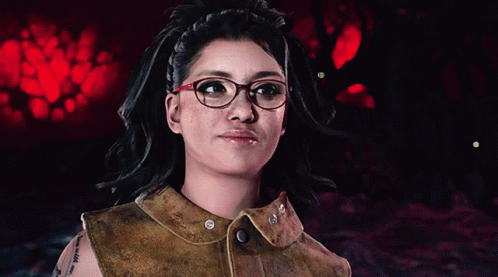A Woman Wearing Glasses And A Brown Leather Vest GIF