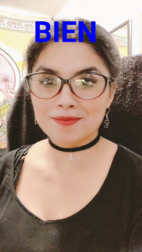 A Woman Wearing Glasses And A Choker Has The Word Bien Written On Her Face GIF