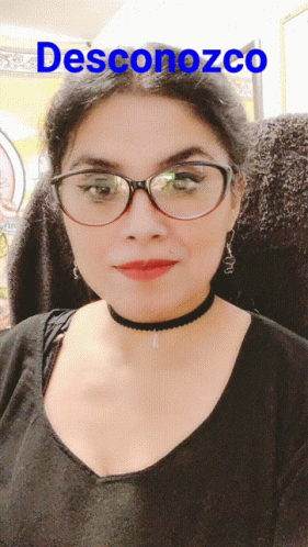 A Woman Wearing Glasses And A Choker Has The Word Desconozco Above Her GIF