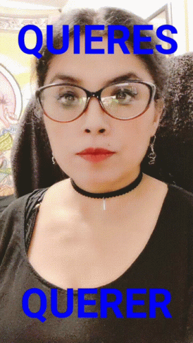 A Woman Wearing Glasses And A Choker Has The Word Quieres Over Her GIF