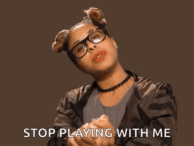 A Woman Wearing Glasses And A Choker Says Stop Playing With Me . GIF