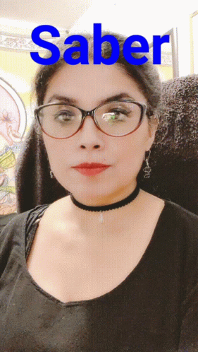 A Woman Wearing Glasses And A Choker With The Word Saber Written On It GIF