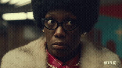 A Woman Wearing Glasses And A Fur Coat With Netflix Written On The Bottom Right GIF