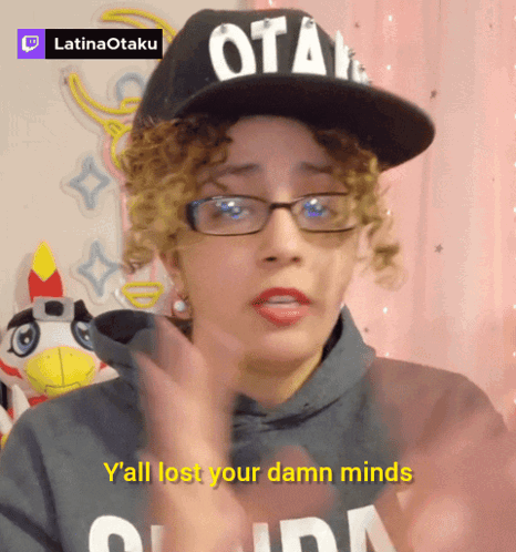 A Woman Wearing Glasses And A Hat That Says Otaku On It GIF