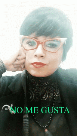 A Woman Wearing Glasses And A Necklace With The Words No Me Gusta On The Bottom Right GIF