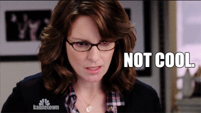 A Woman Wearing Glasses And A Plaid Shirt Says " Not Cool " On A Screen GIF