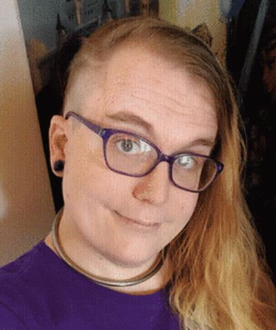 A Woman Wearing Glasses And A Purple Shirt GIF