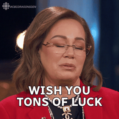 A Woman Wearing Glasses And A Red Jacket Says " Wish You Tons Of Luck " GIF