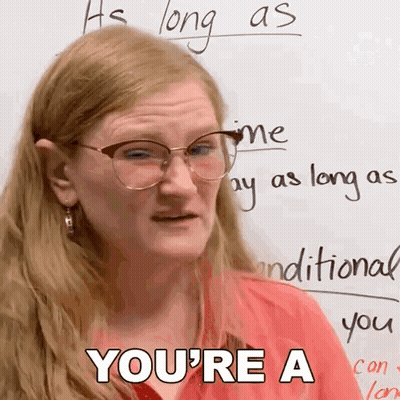 A Woman Wearing Glasses And A Red Shirt Says You 'Re A GIF