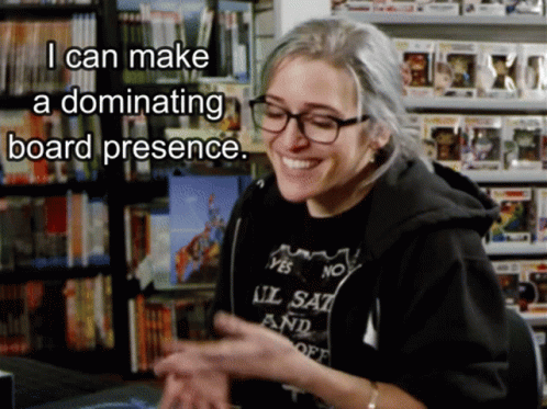 A Woman Wearing Glasses And A Shirt That Says ' I Can Make A Dominating Board Presence ' On It GIF