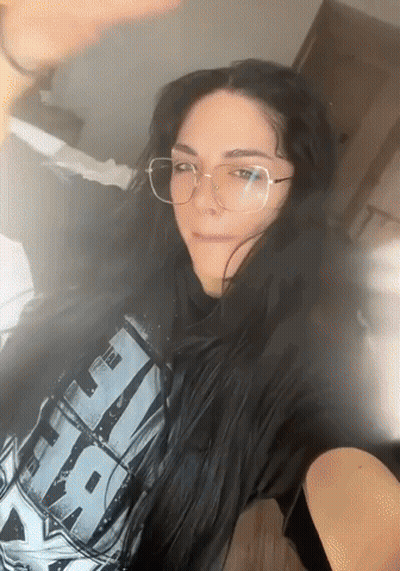 A Woman Wearing Glasses And A T-Shirt That Says " Star Wars " GIF