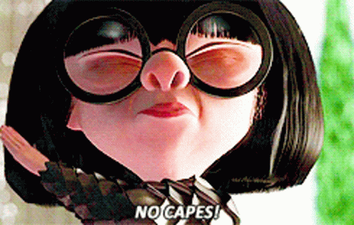 A Woman Wearing Glasses And A Tie Says " No Capes " GIF