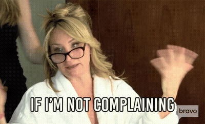 A Woman Wearing Glasses And A White Robe Says If I 'M Not Complaining GIF