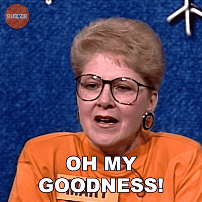 A Woman Wearing Glasses And An Orange Shirt Says " Oh My Goodness " GIF