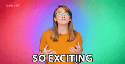 A Woman Wearing Glasses And An Orange Shirt Says " So Exciting " GIF
