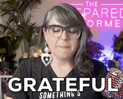 A Woman Wearing Glasses And Earrings Says Grateful Something GIF