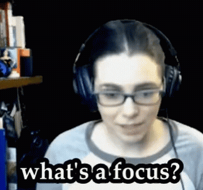 A Woman Wearing Glasses And Headphones Is Asking What 'S A Focus GIF