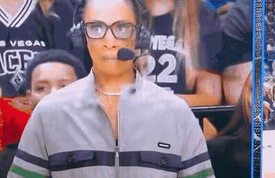 A Woman Wearing Glasses And Headphones With The Number 22 On Her Jersey GIF
