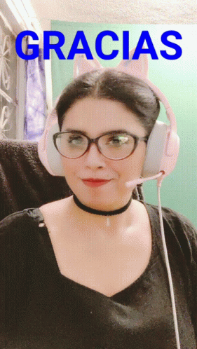 A Woman Wearing Glasses And Headphones With The Word Gracias In Blue GIF