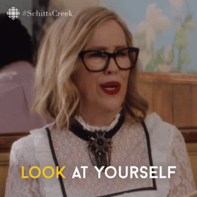 A Woman Wearing Glasses And Red Lipstick Says " Look At Yourself " GIF